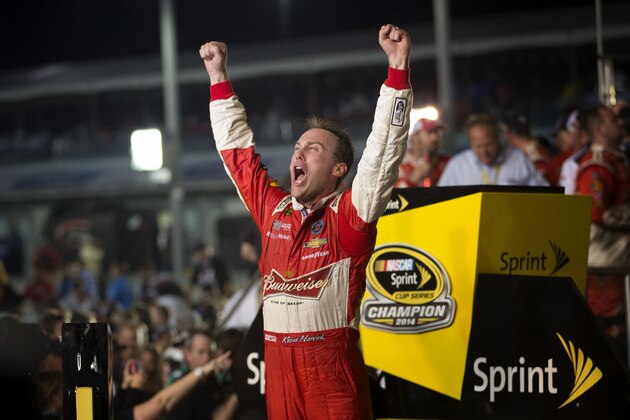 Kevin Harvick celebrates after winning the NASCAR Sprint Cup championship series auto race, Sunday, Nov. 16, 2014, in Homestead, Fla. (AP Photo/J Pat Carter)