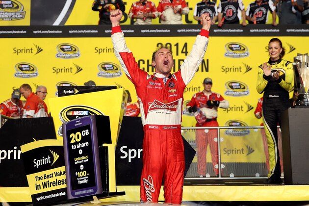 HOMESTEAD, FL - NOVEMBER 16:  Kevin Harvick, driver of the #4 Budweiser Chevrolet, celebrates in victory lane after winning the NASCAR Sprint Cup Series Ford EcoBoost 400 at Homestead-Miami Speedway on November 16, 2014 in Homestead, Florida.  (Photo by Chris Graythen/Getty Images)