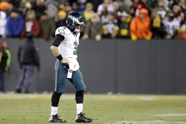 Philadelphia Eagles' Mark Sanchez walks off the field after throwing an interception to Green Bay Packers' Julius Peppers during the second half of an NFL football game Sunday, Nov. 16, 2014, in Green Bay, Wis. (AP Photo/Tom Lynn)