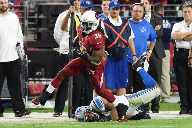 GLENDALE, AZ - NOVEMBER 16:  Running back Andre Ellington #38 of the Arizona Cardinals runs with the football against outside linebacker DeAndre Levy #54 of the Detroit Lions in the third quarter of the NFL game at University of Phoenix Stadium on November 16, 2014 in Glendale, Arizona.  (Photo by Norm Hall/Getty Images)