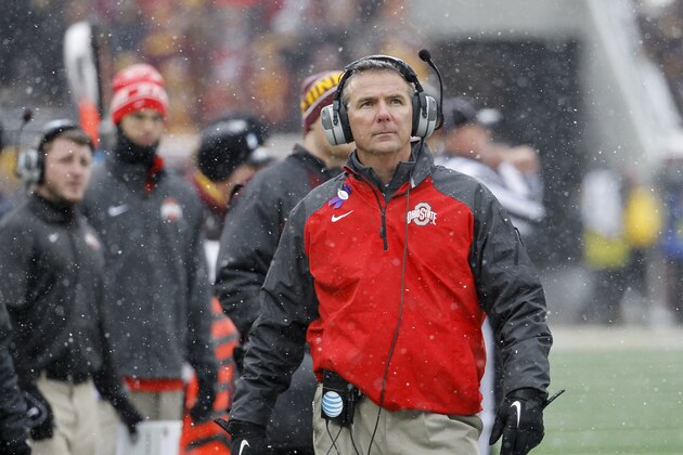Ohio State head coach Urban Meyer walks the sidelines during the fourth quarter of an NCAA college football game against Minnesota in Minneapolis Saturday, Nov. 15, 2014. Ohio State won 31-24. (AP Photo/Ann Heisenfelt)