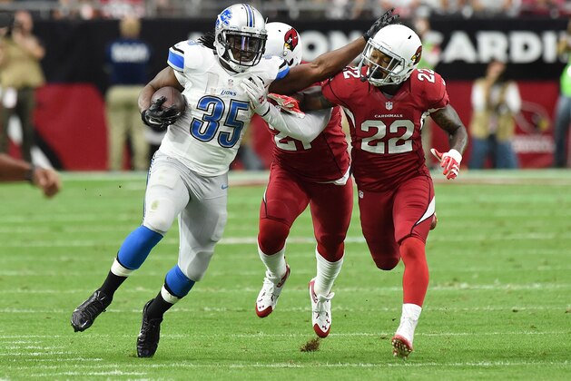 GLENDALE, AZ - NOVEMBER 16:  Running back Joique Bell #35 of the Detroit Lions fends off strong safety Tony Jefferson #22 of the Arizona Cardinals in the first quarter of the NFL game at University of Phoenix Stadium on November 16, 2014 in Glendale, Arizona.  (Photo by Norm Hall/Getty Images)
