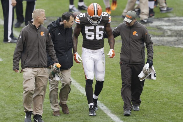Cleveland Browns inside linebacker Karlos Dansby (56) is helped off the field after an injury in the second quarter of an NFL football game against the Houston Texans Sunday, Nov. 16, 2014, in Cleveland. (AP Photo/Tony Dejak)