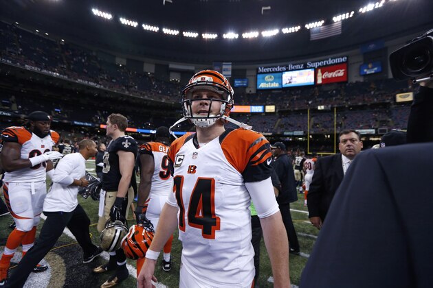 Cincinnati Bengals quarterback Andy Dalton (14) walks on the field after an NFL football game  against the New Orleans Saintsin New Orleans, Sunday, Nov. 16, 2014. (AP Photo/Rogelio Solis)