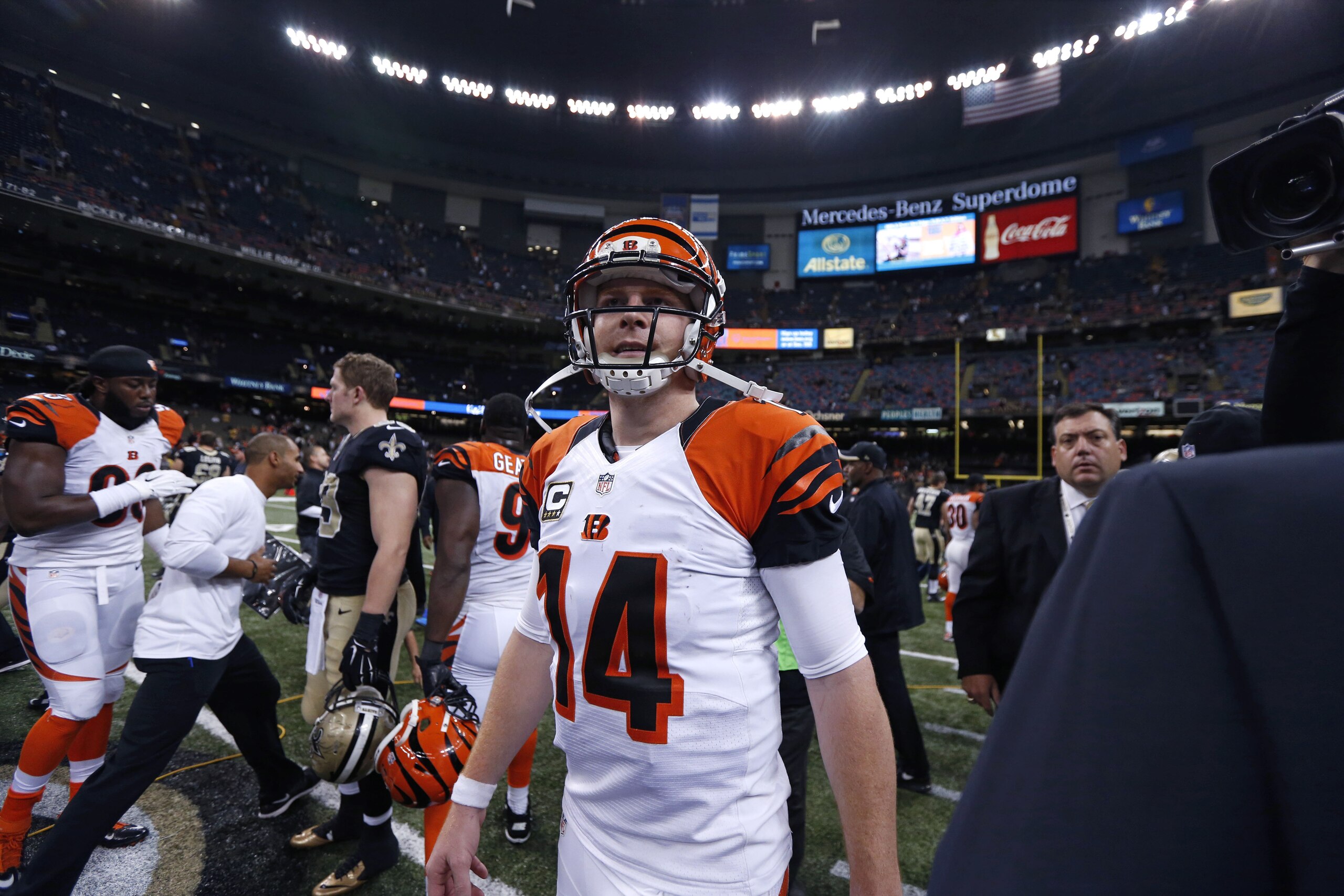 Cincinnati Bengals quarterback Andy Dalton (14) walks on the field after an NFL football game  against the New Orleans Saintsin New Orleans, Sunday, Nov. 16, 2014. (AP Photo/Rogelio Solis)