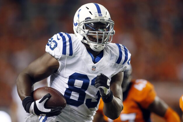 Sep 7, 2014; Denver, CO, USA; Indianapolis Colts tight end Dwayne Allen (83) catches a pass for a touchdown during the second half against the Denver Broncos at Sports Authority Field at Mile High. The Broncos won 31-24. Mandatory Credit: Chris Humphreys-USA TODAY Sports