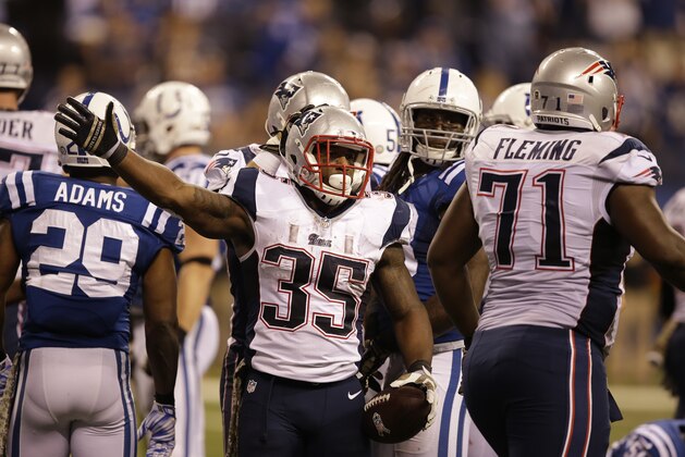 New England Patriots running back Jonas Gray celebrates a first down against the Indianapolis Colts during the second half of an NFL football game in Indianapolis, Sunday, Nov. 16, 2014. (AP Photo/Darron Cummings)