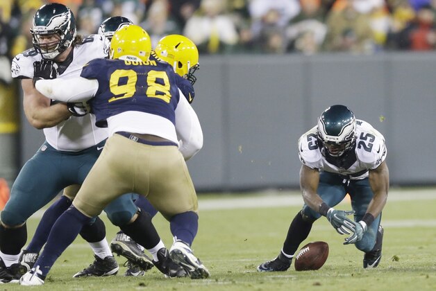 Philadelphia Eagles' LeSean McCoy fumbles the ball during the second half of an NFL football game against the Green Bay Packers Sunday, Nov. 16, 2014, in Green Bay, Wis. (AP Photo/Tom Lynn)