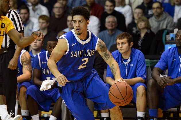 Feb 8, 2014; Philadelphia, PA, USA; Saint Louis Billikens guard Austin McBroom (2) is defended by La Salle Explorers guard Sam Mills (10) during the second half at Tom Gola Arena. St. Louis defeated La Salle 65-63. Mandatory Credit: Howard Smith-USA TODAY Sports