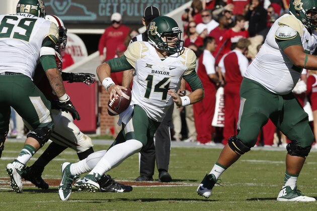 Baylor quarterback Bryce Petty (14) is pictured during an NCAA college football game between Baylor and Oklahoma in Norman, Okla., Saturday, Nov. 8, 2014. Baylor won 48-14. (AP Photo/Sue Ogrocki)