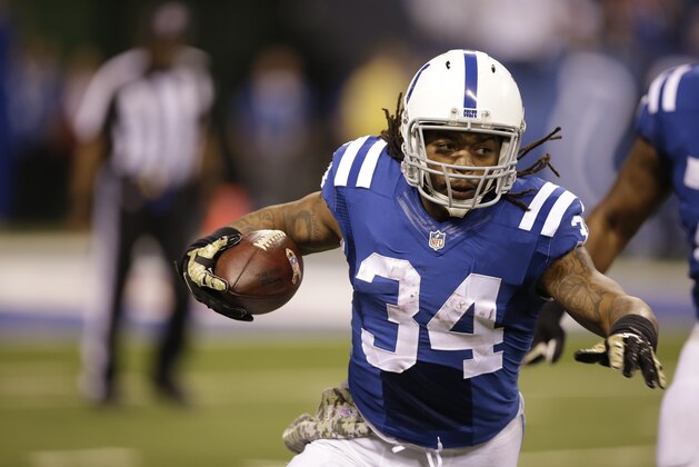 Indianapolis Colts running back Trent Richardson runs against the New England Patriots during the first half of an NFL football game in Indianapolis, Sunday, Nov. 16, 2014. (AP Photo/Darron Cummings)