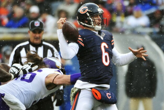CHICAGO, IL - NOVEMBER 16:  Jay Cutler #6 of the Chicago Bears has the ball knocked loose by Brian Robison #96 of the Minnesota Vikings during the second quarter of a game against the Chicago Bears at Soldier Field on November 16, 2014 in Chicago, Illinois. The Bears defeated the Vikings 20-13. (Photo by Jonathan Daniel/Getty Images)