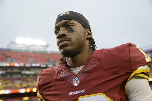 Washington Redskins quarterback Robert Griffin III (10) walks off the field after an NFL football game against the Tampa Bay Buccaneers in Landover, Md., Sunday, Nov. 16, 2014. The Buccaneers defeated the Redskins 27-7. (AP Photo/Patrick Semansky)