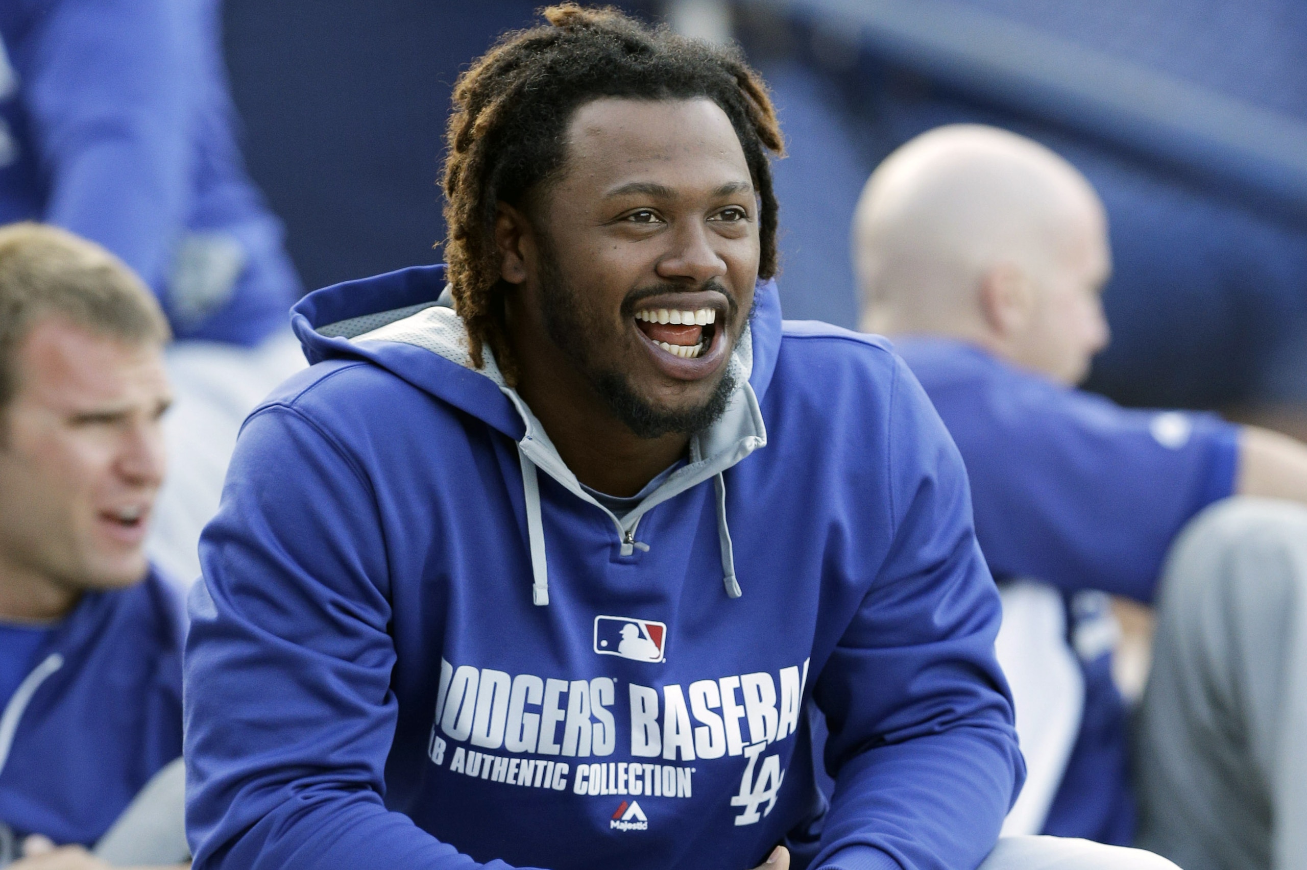 Los Angeles Dodgers' Hanley Ramirez talks with teammates before a baseball game against the Chicago Cubs  in Chicago, Thursday, Sept. 18, 2014. (AP Photo/Nam Y. Huh)