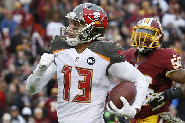 Tampa Bay Buccaneers wide receiver Mike Evans (13) carries the ball into the end zone for a touchdown during the second half of an NFL football game against the Washington Redskins in Landover, Md., Sunday, Nov. 16, 2014. (AP Photo/Alex Brandon)