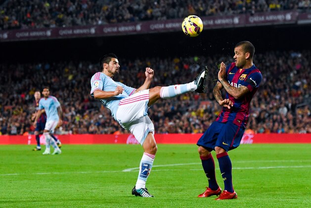 BARCELONA, SPAIN - NOVEMBER 01:  Dani Alves of FC Barcelona competes for the ball with Nolito of Celta de Vigo the La Liga match between FC Barcelona and Celta de Vigo at Camp Nou on November 1, 2014 in Barcelona, Spain.  (Photo by David Ramos/Getty Images)