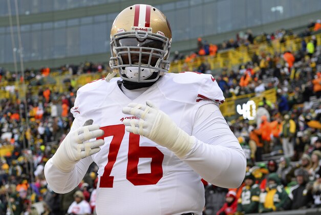 Jan 5, 2014; Green Bay, WI, USA; San Francisco 49ers tackle Anthony Davis (76) walks onto the field prior to the 2013 NFC wild card playoff football game against the Green Bay Packers at Lambeau Field. Mandatory Credit: Mike DiNovo-USA TODAY Sports