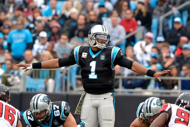 CHARLOTTE, NC - NOVEMBER 16: Cam Newton #1 of the Carolina Panthers gets set at the line of scrimmage against the Atlanta Falcons in the 3rd quarter during their game at Bank of America Stadium on November 16, 2014 in Charlotte, North Carolina.  (Photo by Grant Halverson/Getty Images)