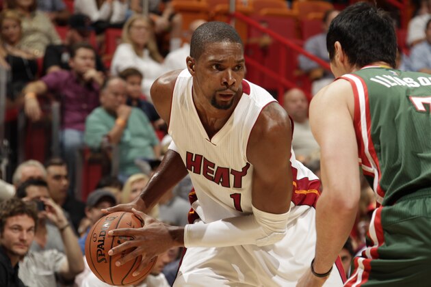MIAMI, FL - NOVEMBER 16:  Chris Bosh #1 of the Miami Heat handles the ball against the Milwaukee Bucks during the game on November 16, 2014 at AmericanAirlines Arena in Miami, Florida. NOTE TO USER: User expressly acknowledges and agrees that, by downloading and or using this Photograph, user is consenting to the terms and conditions of the Getty Images License Agreement. Mandatory Copyright Notice: Copyright 2014 NBAE (Photo by Issac Baldizon/NBAE via Getty Images)