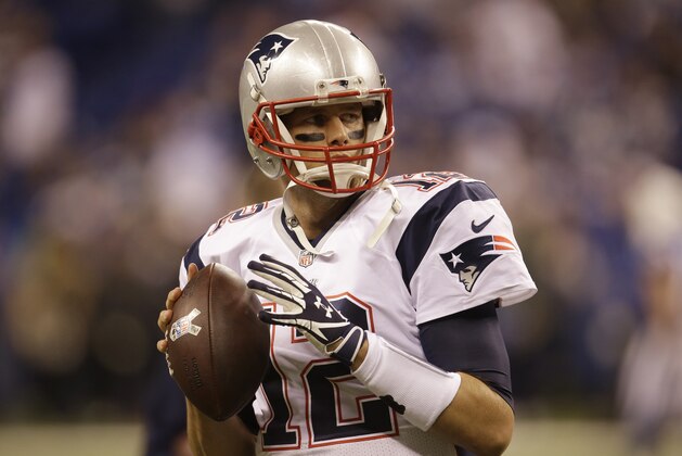 New England Patriots quarterback Tom Brady works before an NFL football game against the Indianapolis Colts in Indianapolis, Sunday, Nov. 16, 2014. (AP Photo/AJ Mast)