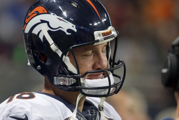 Denver Broncos quarterback Peyton Manning stands on the sidelines during the fourth quarter of an NFL football game against the St. Louis Rams Sunday, Nov. 16, 2014, in St. Louis. The Rams won 22-7. (AP Photo/Charlie Riedel)