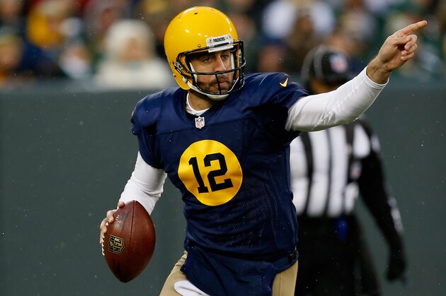 GREEN BAY, WI - NOVEMBER 16:  Quarterback  Aaron Rodgers #12 of the Green Bay Packers points while playing against the Philadelphia Eagles during the second quarter of the game at Lambeau Field on November 16, 2014 in Green Bay, Wisconsin.  (Photo by Mike Zarrilli/Getty Images)