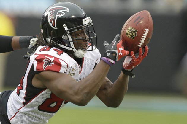Atlanta Falcons' Roddy White (84) just misses catching a pass against the Carolina Panthers in the second half of an NFL football game in Charlotte, N.C., Sunday, Nov. 16, 2014. (AP Photo/Bob Leverone)