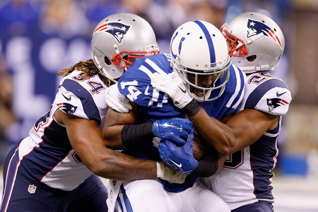 INDIANAPOLIS, IN - NOVEMBER 16:  Hakeem Nicks #14 of the Indianapolis Colts is tackled by  Dont'a Hightower #54 and Logan Ryan #26 of the New England Patriots after a reception in the third quarter during the game at Lucas Oil Stadium on November 16, 2014 in Indianapolis, Indiana.  (Photo by Joe Robbins/Getty Images)
