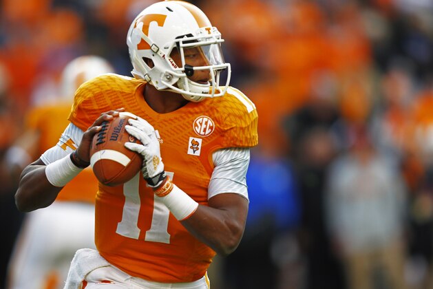 Tennessee quarterback Joshua Dobbs (11) looks for a receiver during an NCAA college football game against Kentucky Saturday, Nov. 15, 2014 in Knoxville, Tenn. (AP Photo/Wade Payne)
