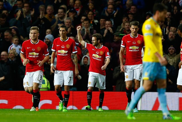 MANCHESTER, ENGLAND - NOVEMBER 08:  Juan Mata of Manchester United celebrates scoring the first goal during the Barclays Premier League match between Manchester United and Crystal Palace at Old Trafford on November 8, 2014 in Manchester, England.  (Photo by Clive Rose/Getty Images)