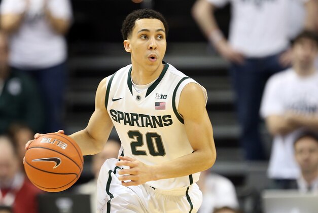Feb 16, 2014; East Lansing, MI, USA; Michigan State Spartans guard Travis Trice (20) brings the ball up court against the Nebraska Cornhuskers during the 2nd half of a game at Jack Breslin Student Events Center. Nebraska won 60-51. Mandatory Credit: Mike Carter-USA TODAY Sports