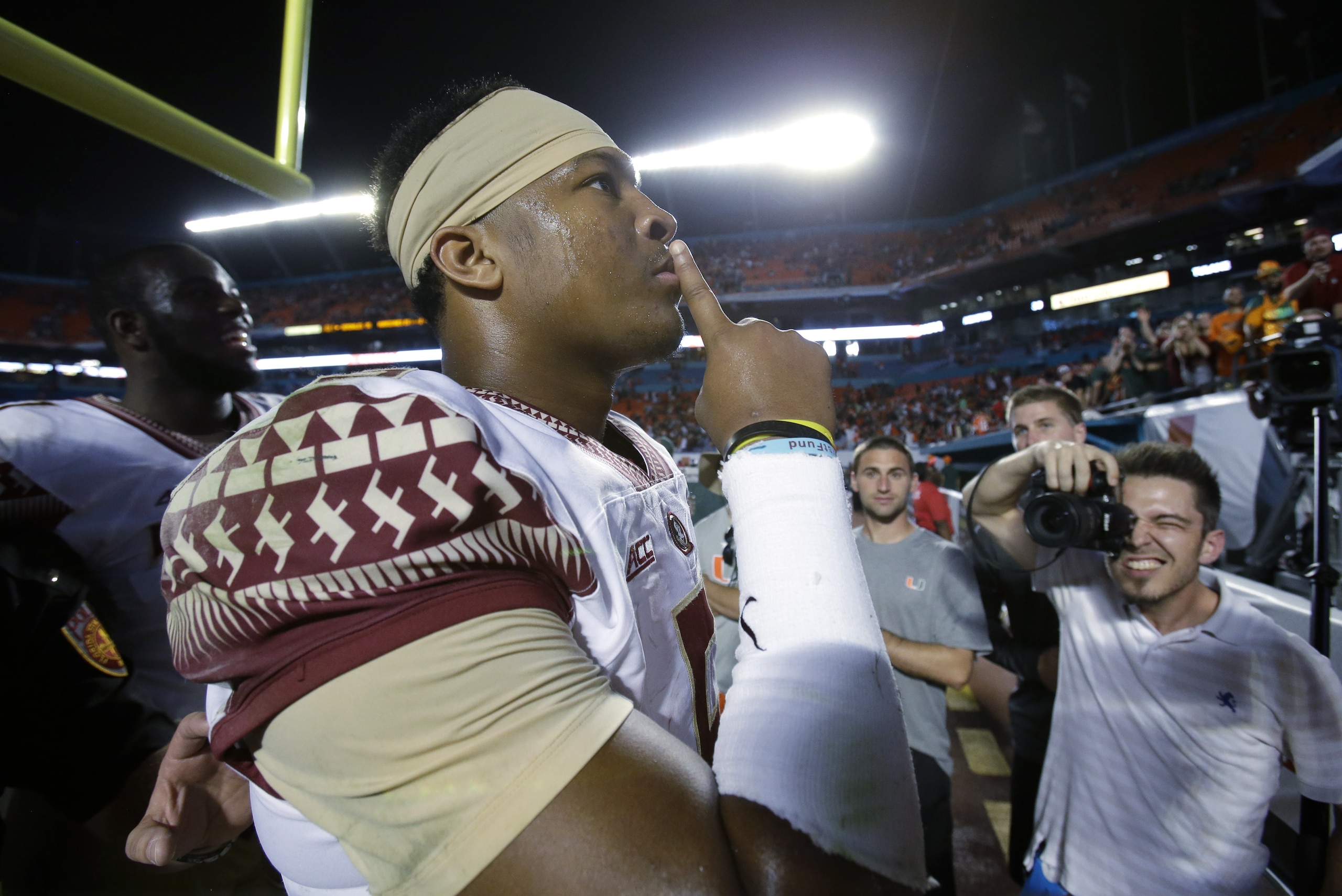 Florida State quarterback Jameis Winston gestures to the crowd after Florida State defeated Miami 30-26 in an NCAA College football game, Saturday, Nov. 15, 2014 in Miami Gardens, Fla. (AP Photo/Wilfredo Lee)