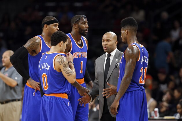 New York Knicks head coach Derek Fisher talks with players during a timeout against the Detroit Pistons in the second half of an NBA basketball game in Auburn Hills, Mich., Wednesday, Nov. 5, 2014.  (AP Photo/Paul Sancya)