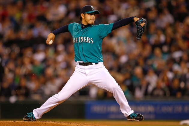 SEATTLE, WA - SEPTEMBER 26: Starting pitcher Hisashi Iwakuma #18 of the Seattle Mariners pitches against the Los Angeles Angels of Anaheim in the first inning at Safeco Field on September 26, 2014 in Seattle, Washington. (Photo by Otto Greule Jr/Getty Images)