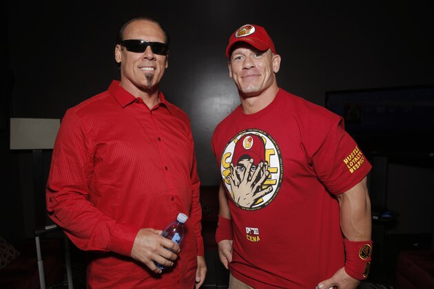 WWE 2K15 cover Superstar John Cena (right) meets with Sting backstage at the SummerSlam Confidential Panel on at Club Nokia, on Saturday, August 16, 2014 in Los Angeles. (Photo by Todd Williamson/Invision for 2K/AP Images)
