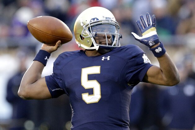 Notre Dame quarterback Everett Golson (5) looks to a pass during the first half of an NCAA college football game against Northwestern in South Bend, Ind., Saturday, Nov. 15, 2014. (AP Photo/Nam Y. Huh)