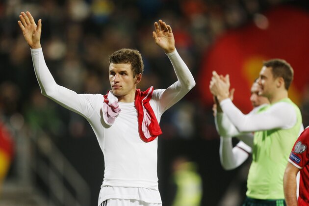 Germany's Thomas Mueller waves to the supporters after a Group D Euro 2016 qualifying match between Germany and Gibraltar in Nuremberg, Germany, Friday, Nov. 14, 2014. (AP Photo/Michael Probst)