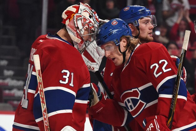 MONTREAL, QC - NOVEMBER 13: Dale Weise #22 of the Montreal Canadiens celebrates the victory with Carey Price #31 against the Boston Bruins in the NHL game at the Bell Centre on November 13, 2014 in Montreal, Quebec, Canada. (Photo by Francois Lacasse/NHLI via Getty Images)