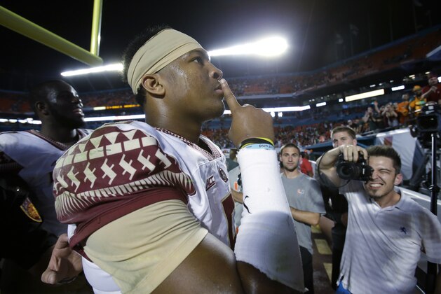 Florida State quarterback Jameis Winston gestures to the crowd after Florida State defeated Miami 30-26 in an NCAA College football game, Saturday, Nov. 15, 2014 in Miami Gardens, Fla. (AP Photo/Wilfredo Lee)
