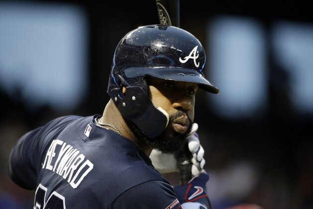 Atlanta Braves' Jason Heyward takes some warm up swings on deck against the Texas Rangers during a baseball game, Friday, Sept. 12, 2014, in Arlington, Texas. (AP Photo/Tony Gutierrez)