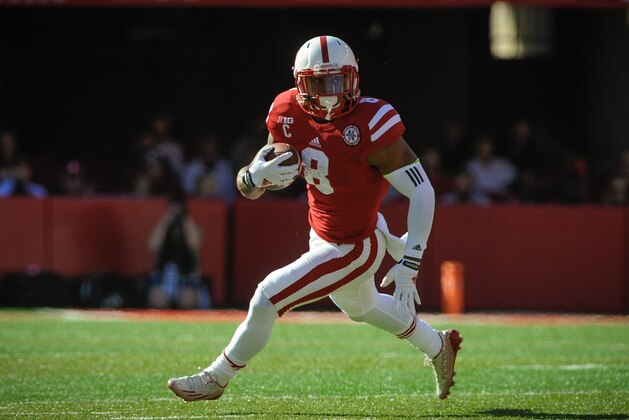 LINCOLN, NE - OCTOBER 25: Running back Ameer Abdullah #8 of the Nebraska Cornhuskers runs for a touchdown during the game against the Rutgers Scarlet Knights at Memorial Stadium on October 25, 2014 in Lincoln, Nebraska. Abdullah set a school record for career all-purpose yards. Nebraska defeated Rutgers 42-24. (Photo by Eric Francis/Getty Images)