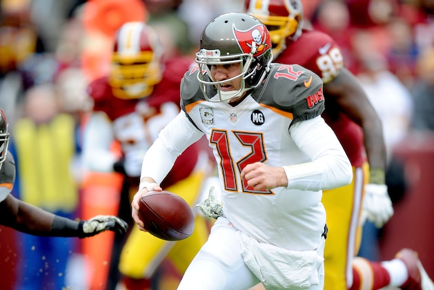 LANDOVER, MD - NOVEMBER 16: Quarterback Josh McCown #12 of the Tampa Bay Buccaneers scrambles during the first quarter of a game against the Washington Redskins at FedExField on November 16, 2014 in Landover, Maryland.  (Photo by Mitchell Layton/Getty Images)