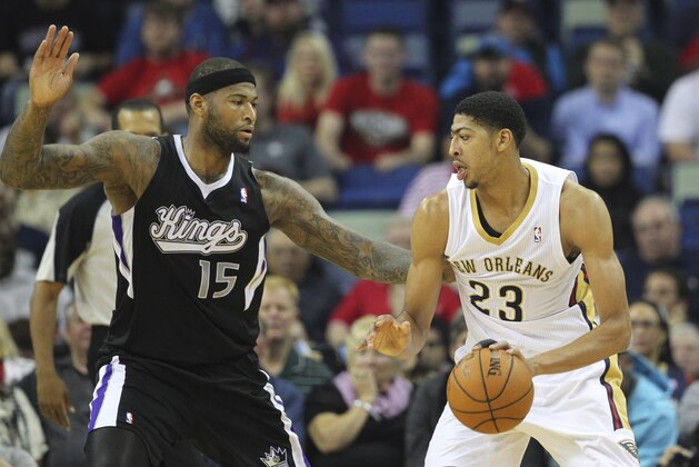 Mar 31, 2014; New Orleans, LA, USA; New Orleans Pelicans forward Anthony Davis (23) is defended by Sacramento Kings center DeMarcus Cousins (15) in the first quarter at the Smoothie King Center. Mandatory Credit: Crystal LoGiudice-USA TODAY Sports