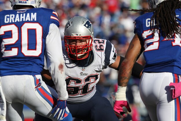 Oct 12, 2014; Orchard Park, NY, USA; New England Patriots center Ryan Wendell (62) during the second half against the Buffalo Bills at Ralph Wilson Stadium. New England beats Buffalo 37 to 22.  Mandatory Credit: Timothy T. Ludwig-USA TODAY Sports