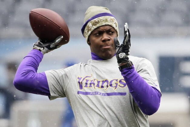 Minnesota Vikings quarterback Teddy Bridgewater warms up before an NFL football game between the Vikings and Chicago Bears Sunday, Nov. 16, 2014, in Chicago. (AP Photo/Charles Rex Arbogast)