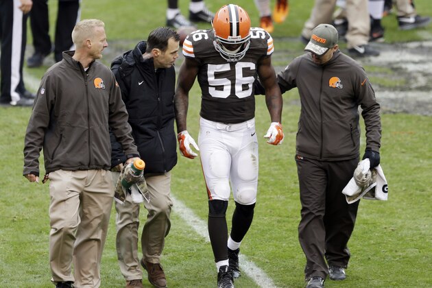 Cleveland Browns inside linebacker Karlos Dansby (56) is helped off the field after an injury in the second quarter of an NFL football game against the Houston Texans, Sunday, Nov. 16, 2014, in Cleveland. (AP Photo/Tony Dejak)