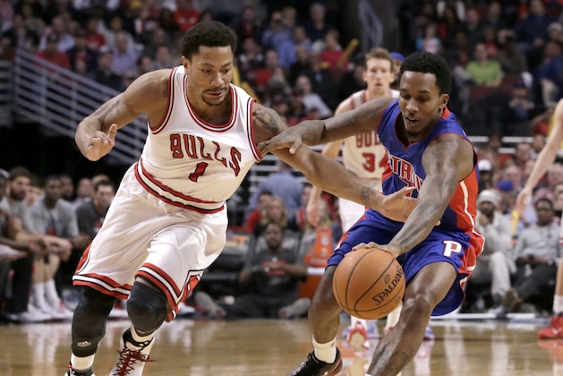 Chicago Bulls guard Derrick Rose (1) battles Detroit Pistons guard Brandon Jennings (7) for a loose ball during the second half of an NBA basketball game Monday, Nov. 10, 2014, in Chicago. The Bulls won 102-91. (AP Photo/Charles Rex Arbogast)
