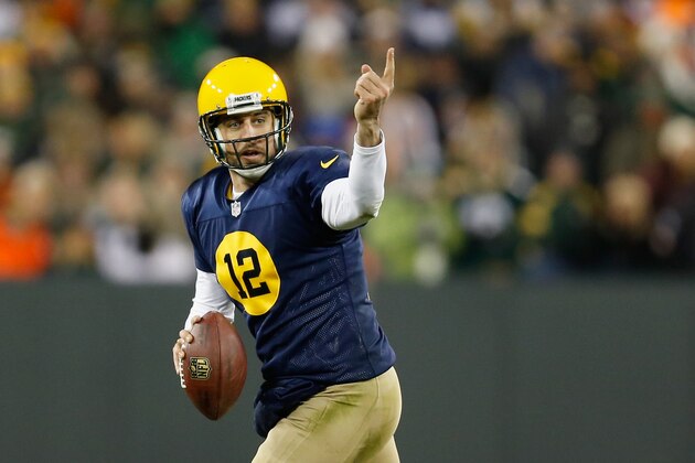 GREEN BAY, WI - NOVEMBER 16:  Quarterback  Aaron Rodgers #12 of the Green Bay Packers reacts while looking to pass against the Philadelphia Eagles during the third quarter of the game at Lambeau Field on November 16, 2014 in Green Bay, Wisconsin.  (Photo by Mike Zarrilli/Getty Images)
