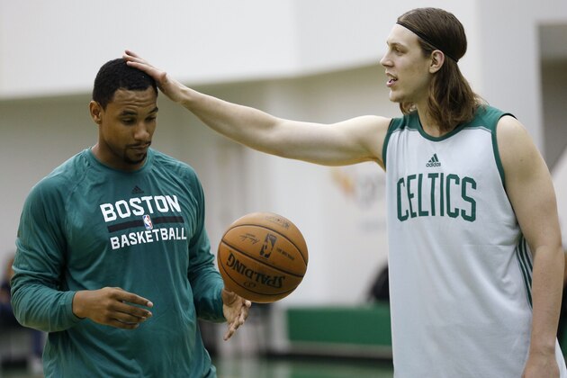 Boston Celtics' Kelly Olynyk, right, checks out Jared Sullinger's haircut during NBA basketball practice in Waltham, Mass., Tuesday, Sept. 30, 2014. (AP Photo/Michael Dwyer)
