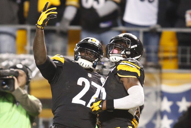 Nov 2, 2014; Pittsburgh, PA, USA; Pittsburgh Steelers running back LeGarrette Blount (27) and running back Le'Veon Bell (26) celebrate a touchdown catch by Bell against the Baltimore Ravens during the second quarter at Heinz Field. Mandatory Credit: Charles LeClaire-USA TODAY Sports